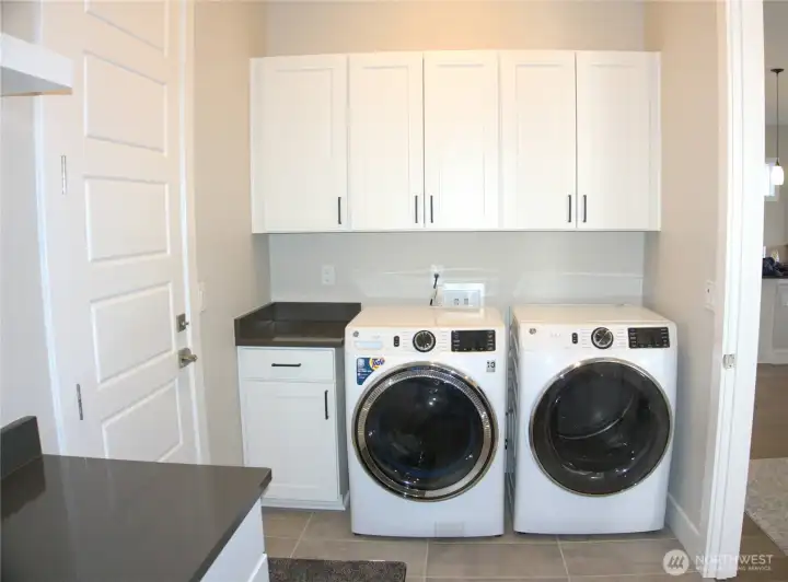 oversized laundry room with great storage