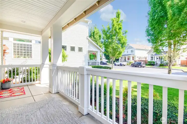 Large front porch with beautiful columns & railing, looks out to the picturesque neighborhood.