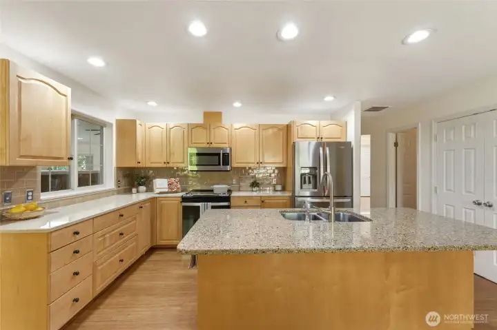 Spacious Kitchen with Stainless Steel, Pantry and Island with Bar Seating