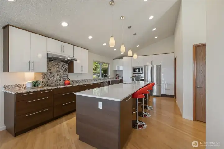 Fully remodeled kitchen with expansive white quartz countertops.