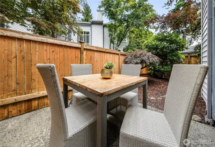 A fully fenced patio and private yard extend the living space outdoors, creating an inviting and private setting for alfresco dining or secure space for pets. A fully fenced patio and private yard extend the living space outdoors, creating an inviting and private setting for alfresco dining or secure space for pets.