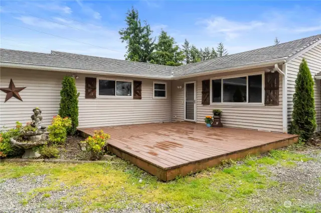 Nicely landscaped around house, walk onto the wood porch to enter home.