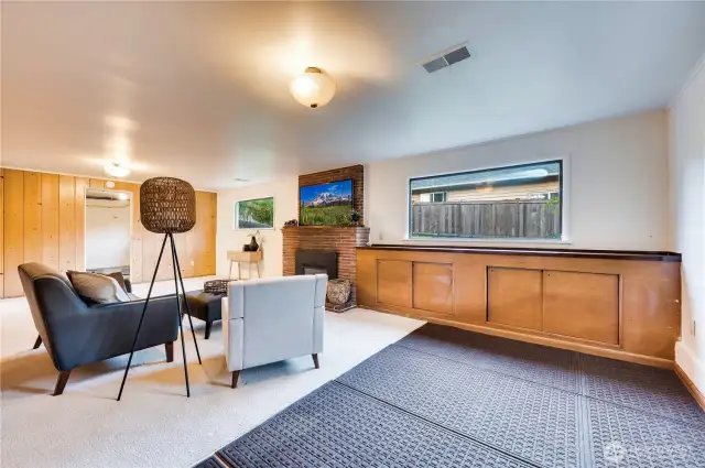 Lots of built-in storage in the family room plus a cozy gas fireplace for relaxing.