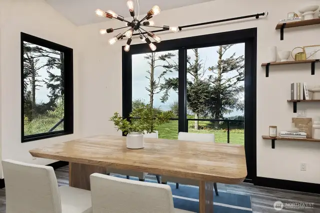 Dining area with a sliding door out to deck.