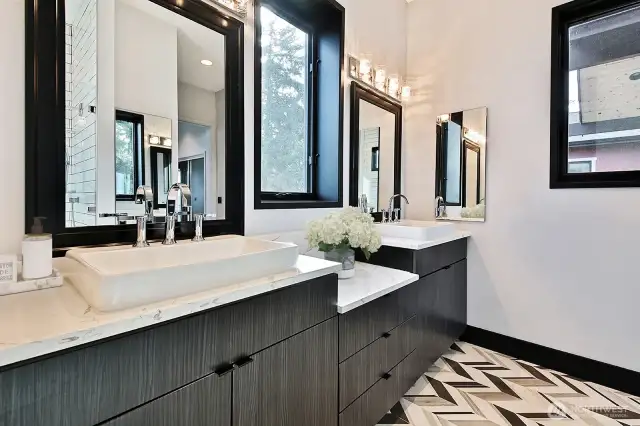 Primary Bath. Soft stone flooring, heated floors, Double sinks and walk-in shower.