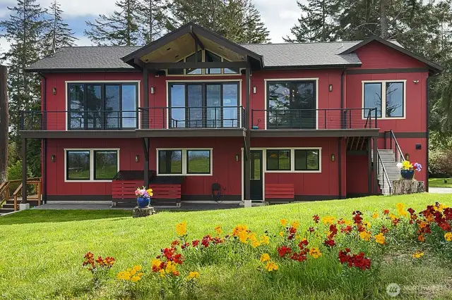 The side deck to the left is off the mother-in-law suite. (It can also function as an Airbnb.)