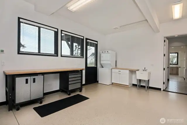 Oversized two-car garage. Work bench station. Stackable w/d for MIL across the way on the same level. Door that exits outside.