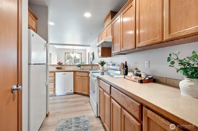 The good sized kitchen leads to a great room and dining area.