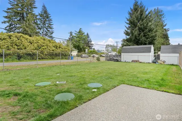 2 fully fenced backyards are flat and totally usable. There are patios off of the back of each unit.