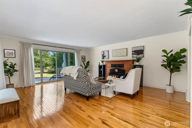 Spacious Living Room with fireplace and slider access to deck