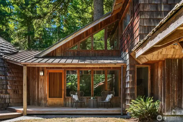 With its metal roof and cedar siding, this home seamlessly blends into the surrounding 20-acre retreat.