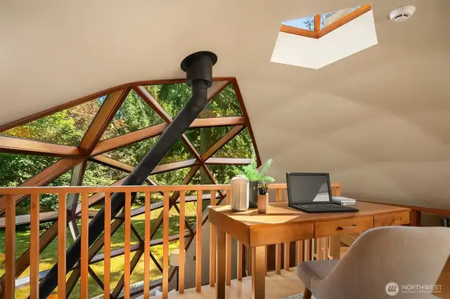 The loft overlooks the central dome and offers a flexible space—perfect for a home office, reading nook, or cozy den—your choice!
