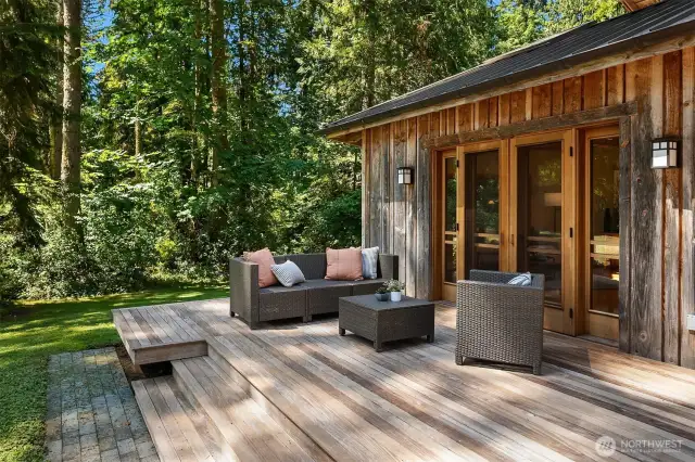 Spacious deck off the living room wraps around to the front entry—perfect for relaxing, entertaining, or soaking in the surrounding views.