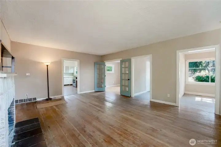 Living room showing French doors and hardwood floors