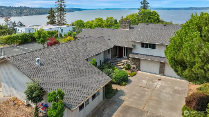 Home has a very long driveway in addition to a roundabout driveway