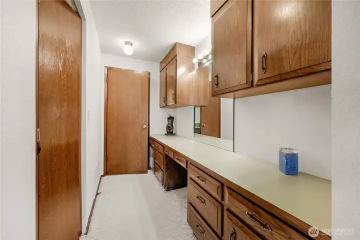 Additional closet/vanity area for primary room with access to bedroom 3