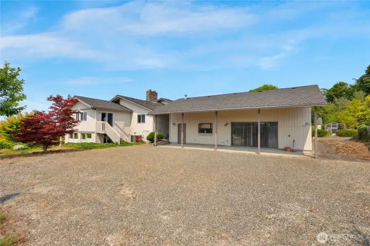 View of the side of the home and behind the guest home/unit