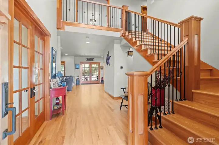 Enter to the beautiful foyer....real hardwoods, wrought iron railings and a wide hallway