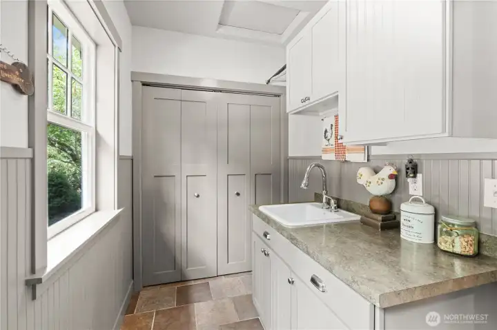 Mudroom off of the back patio is the perfect place to leave the world behind as you walk into your home
