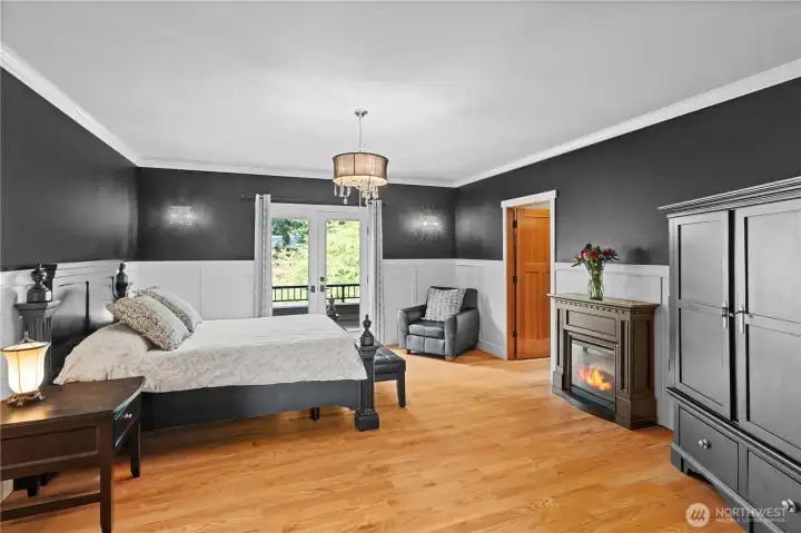 This is simply elegant!  Chair railing, dramatic colors, real hardwoods and a deck overlooking your property