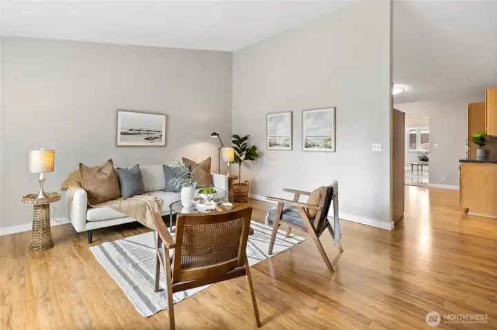 Front living room to kitchen. The hallway to the bedrooms is on the right.