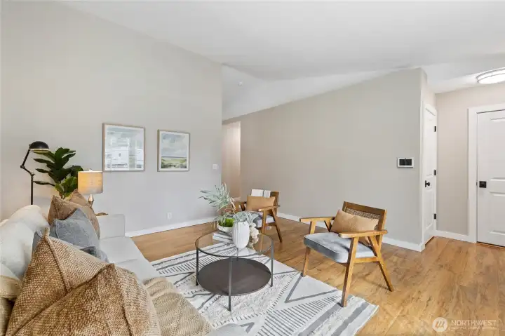 The door on the far right leads to the garage. The door on the left is a coat closet. The opening in the middle of the picture is the hallway to the bedrooms.