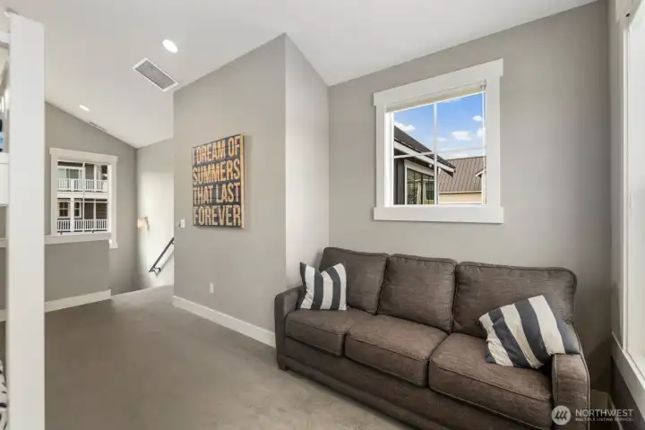 Upper level loft space perfect for media room or overflow bunkroom