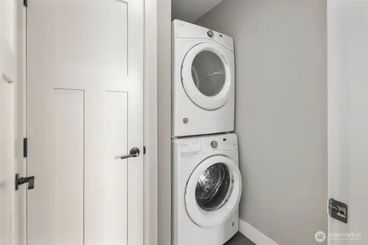 Upper level laundry room with linen closet