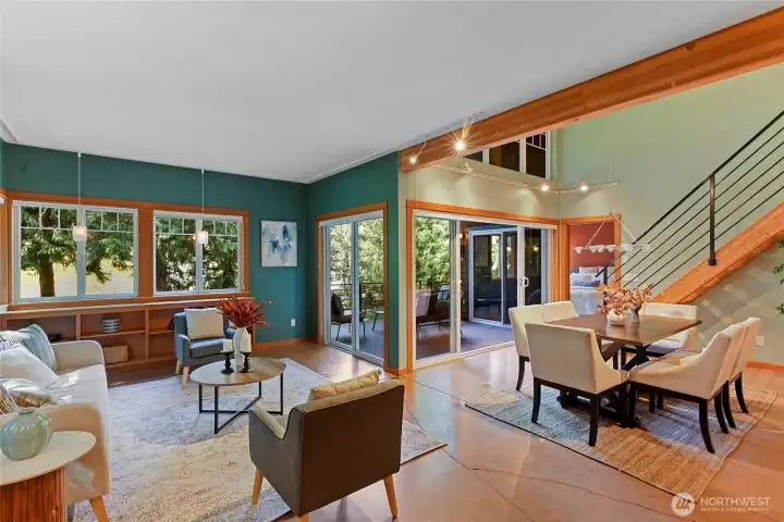Living room, dining room, three way deck access.