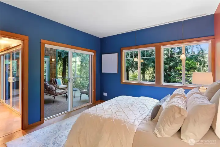 Primary bedroom, dining room and deck access.