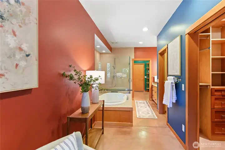 View of primary bath through to the laundry/mudroom.