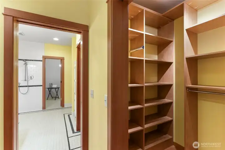 Bedroom #2 walk-in closet, water closet on the left, and wired for sauna in the room straight ahead beyond.