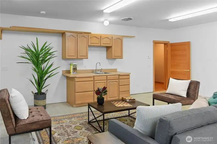 Great potential for a lower level kitchen, party room, or hobby center.