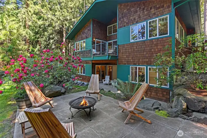 Yard elevation entertainment patio, lower level covered patio, main floor covered deck.