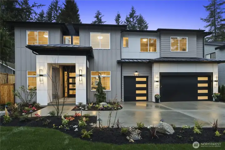 Front Exterior: Hamish Anderson Custom Homes presents a one-of-a-kind NW Contemporary home in North Rose Hill. Expansive, approx. 10,000 sq. ft. homesite, a covered front porch, and a three-car garage.