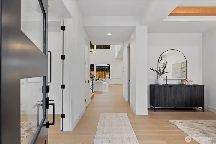 Spacious entry foyer with the formal dining room on the right an dthe office on the left.