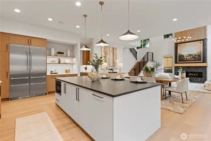 Thermador appliance suite: Side-by-side refrigerator with water dispensor, four freezer drawers and built-in ice maker.