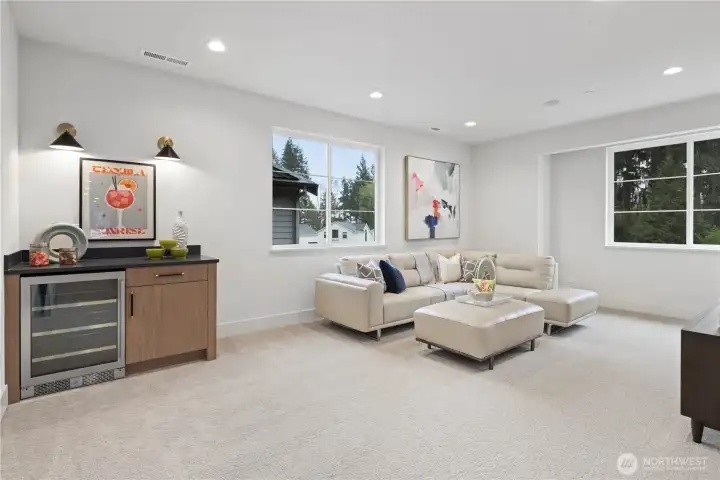 Bonus room with snack bar and beverage center and prewired for speakers.