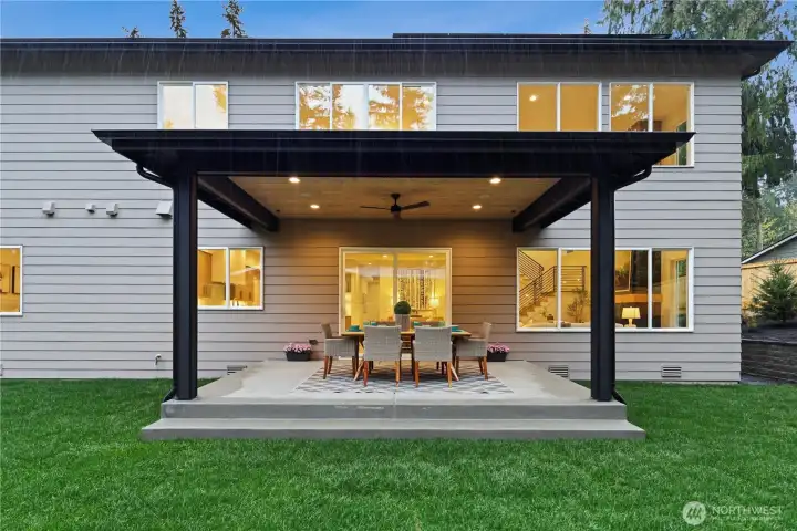 Wide sliding glass door leads to the large covered outdoor patio. Ceiling fan, prewired for sound, dedicated gas BBQ line as well as a gas line that can be sued for a fire table. Prewired for ceiling heaters.