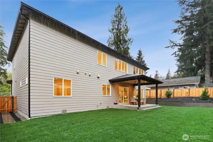 Approx. 10,000 sq. ft. fully fenced, level, grassy backyard.