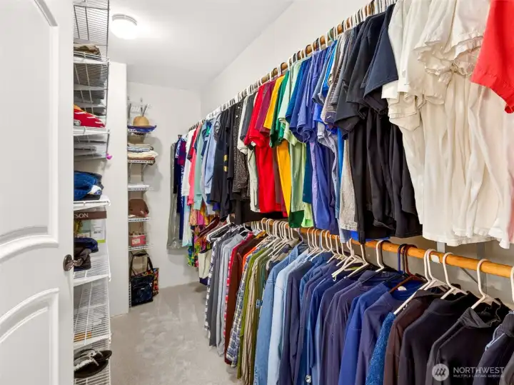 The walk-in primary closet offers generous double-hung rod space, built-in shelving, and room to organize every wardrobe with ease. Wardrobe storage that lives up to the rest of the suite.