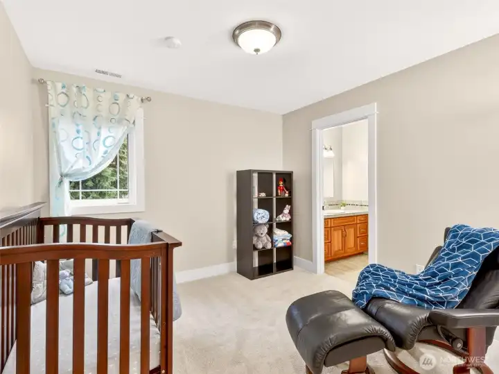 A versatile upstairs bedroom with adjoining Jack-and-Jill style bath flexible use as a nursery, guest suite, or home office. Privacy and convenience all in one well-designed space.
