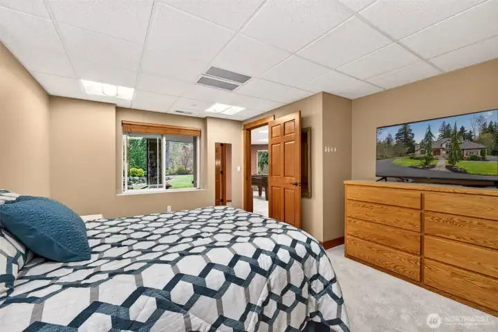 A spacious lower-level bedroom offers comfort, privacy, and flexibility, ideal as a guest suite, teen retreat, or extended-stay accommodation.
