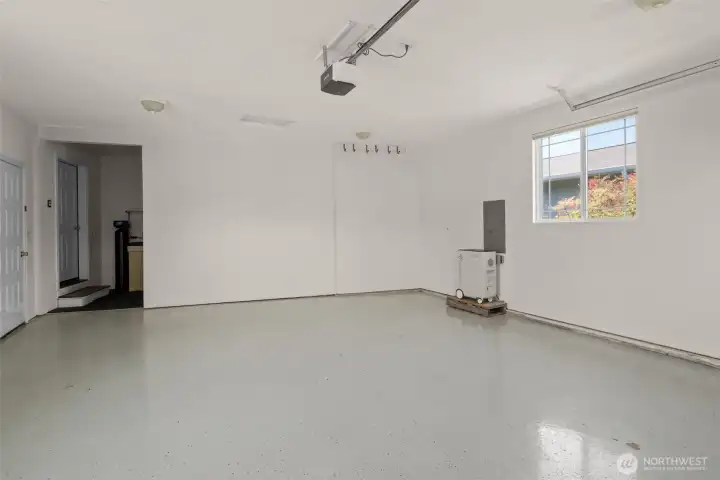 Garage with epoxy flooring. Battery back up stays (provides up to 48 hours of heat & basic power)