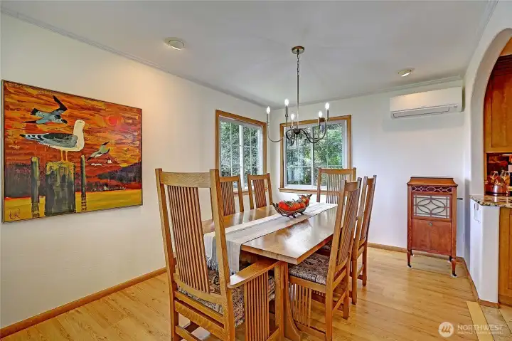 Dining area with craftsman style table to match the cabinets. Table can stay with sale if buyers prefer..