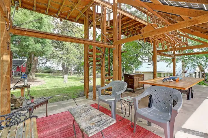 The custom-built solar palace has a wood spiral staircase to access solar panels for maintenance...