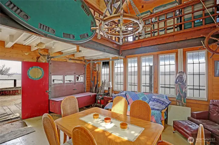 Main level of boat house is spacious and even has roll up garage door to sprawl out onto the deck...