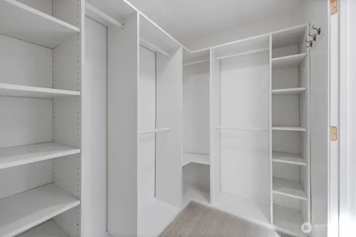 Walk-in primary closet Walk-in primary closet