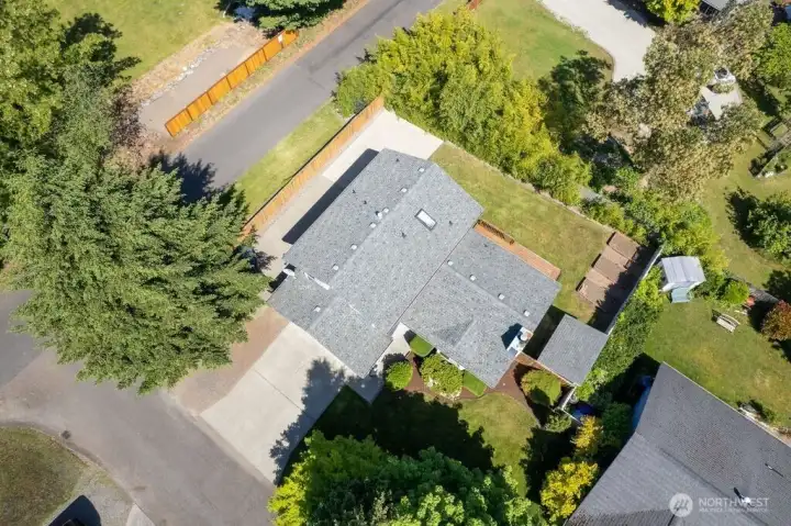 Your corner lot comes with space to park an RV or boat beyond the side gate to the left of your two-car garage. Your corner lot comes with space to park an RV or boat beyond the side gate to the left of your two-car garage.