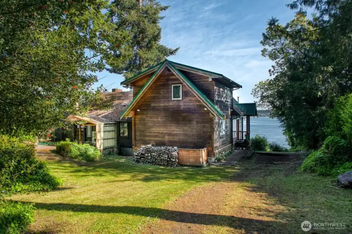 Half Acre + of mature landscaping, Park in Driveway and enter the newer addition. Firewood harvested from the property to keep your fire pit going, even on cold, starry nights!